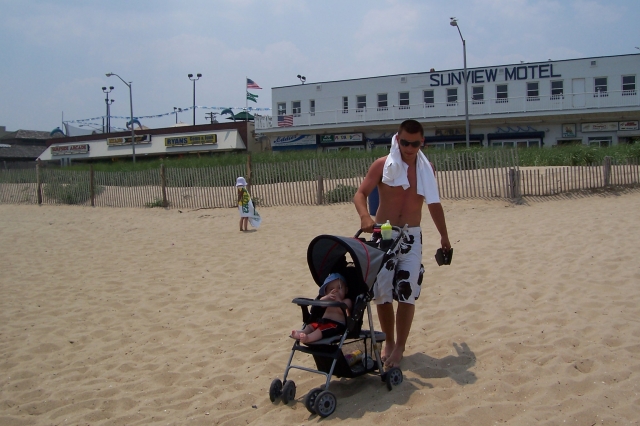 Charlie DeRose 19 - (the missing in action from Easter dinner son)
taking his nephew for a stroll on the boardwalk to attract chicks - July 2007 (a true DeRose)